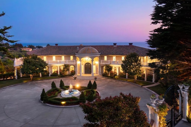 mediterranean / spanish-style home featuring a balcony