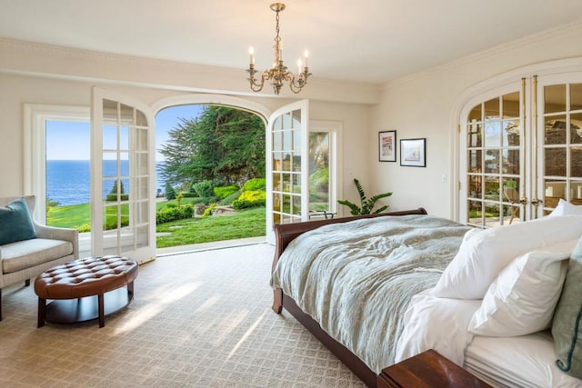 bedroom featuring french doors, an inviting chandelier, access to outside, a water view, and ornamental molding