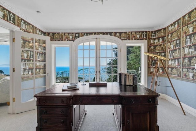 carpeted office featuring a water view