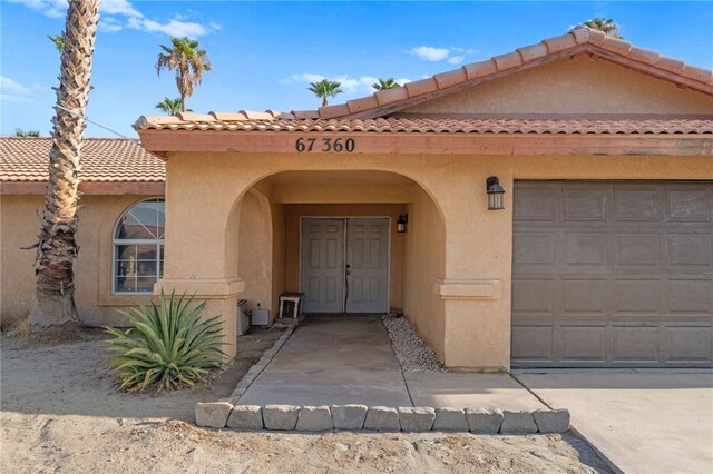 doorway to property featuring a garage