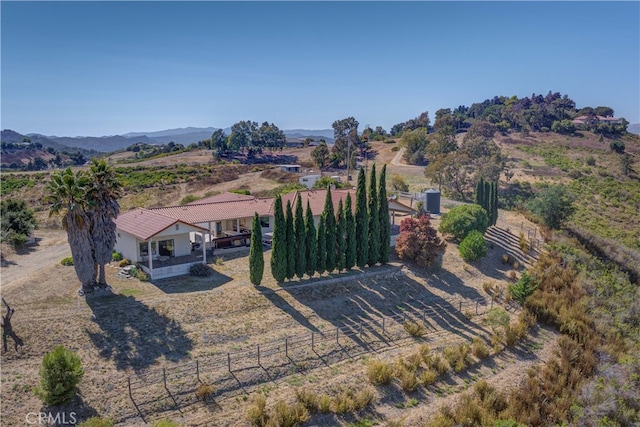 birds eye view of property with a mountain view and a rural view