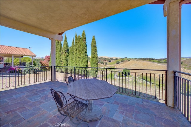 view of patio / terrace with a balcony