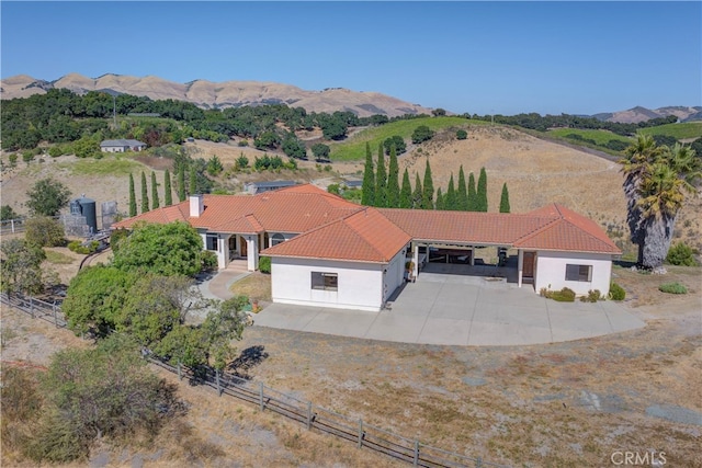 birds eye view of property with a mountain view