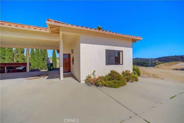 exterior space featuring a carport