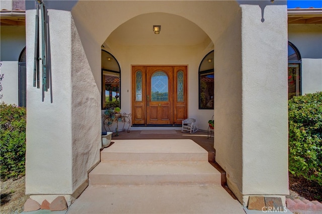 entrance to property with covered porch