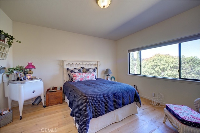 bedroom with light hardwood / wood-style flooring