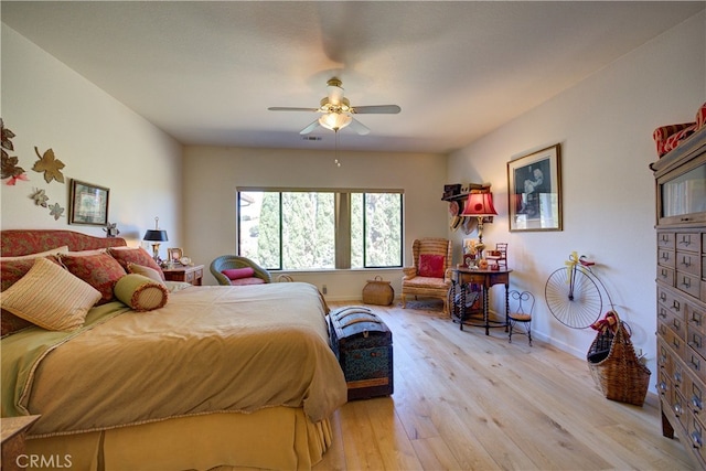 bedroom featuring light hardwood / wood-style floors and ceiling fan