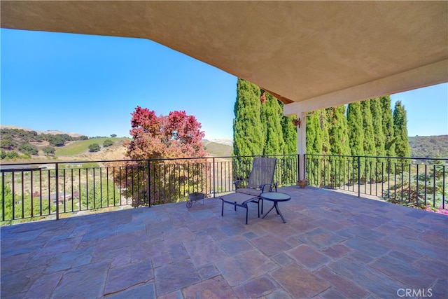 view of patio with a balcony