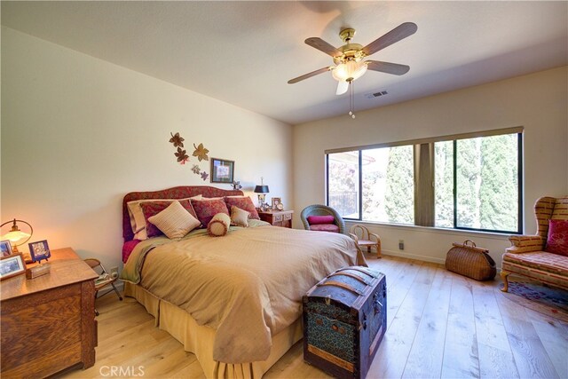 bedroom featuring light hardwood / wood-style floors and ceiling fan