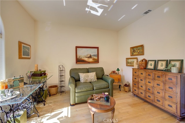 living room with light hardwood / wood-style flooring