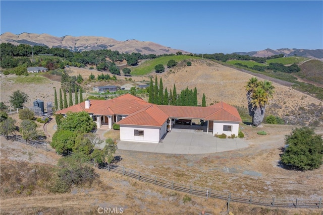 aerial view with a mountain view and a rural view