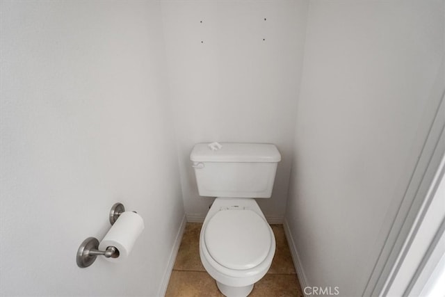 bathroom with tile patterned floors and toilet