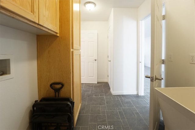 corridor with dark tile patterned flooring