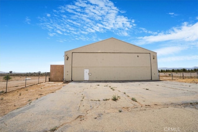 garage featuring a rural view