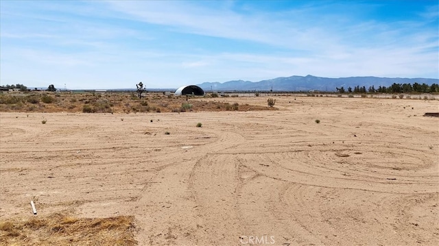 property view of mountains featuring a rural view