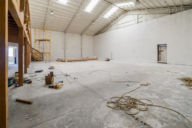 miscellaneous room with high vaulted ceiling