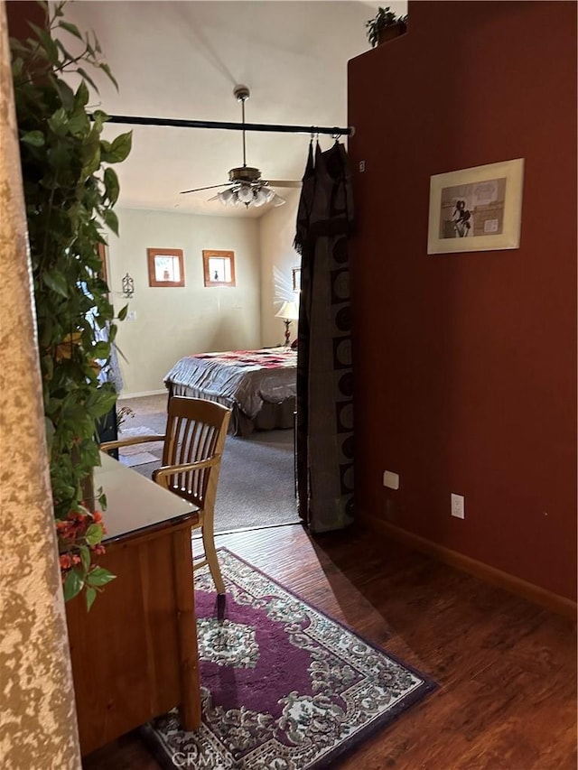 bedroom with dark wood-type flooring