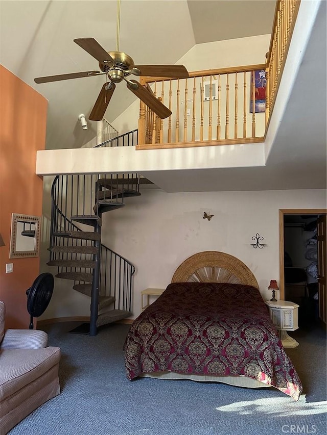 bedroom with carpet flooring and a towering ceiling