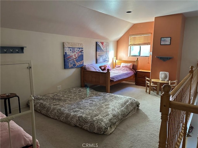 carpeted bedroom with vaulted ceiling