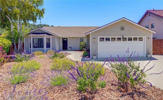 single story home featuring a garage