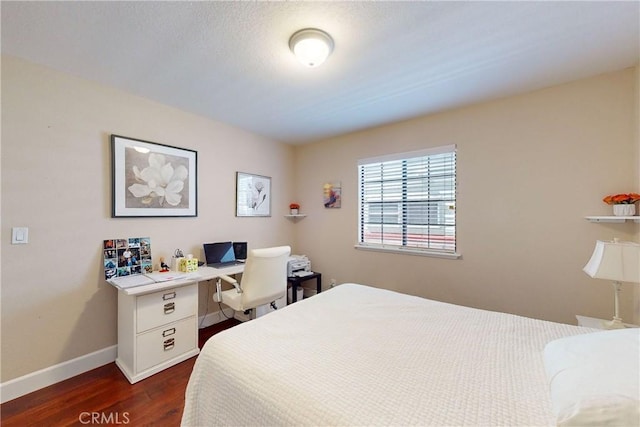 bedroom featuring dark hardwood / wood-style flooring