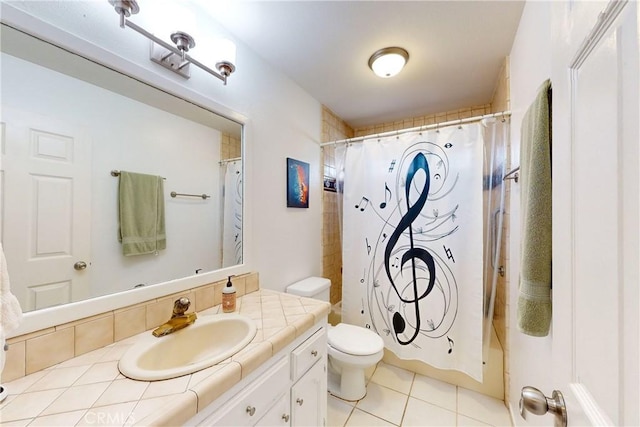 bathroom featuring tile patterned floors, toilet, and vanity