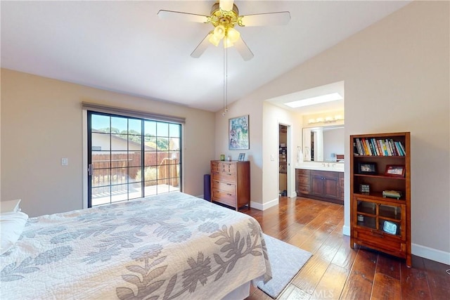 bedroom featuring ceiling fan, hardwood / wood-style flooring, lofted ceiling, and ensuite bath