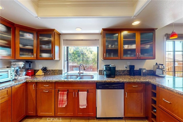 kitchen featuring sink, a tray ceiling, dishwasher, and ornamental molding