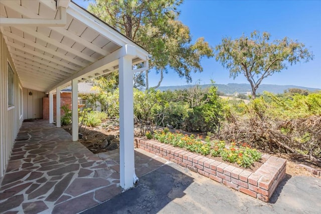 view of patio / terrace with a mountain view