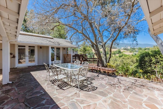 view of patio featuring a mountain view and french doors