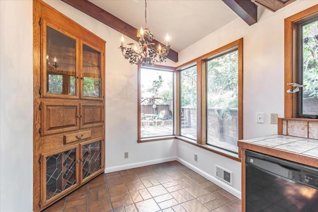 dining space featuring an inviting chandelier and vaulted ceiling with beams