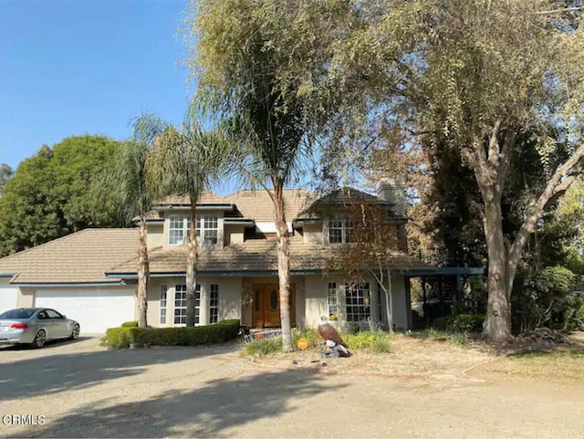 view of front of property with a garage