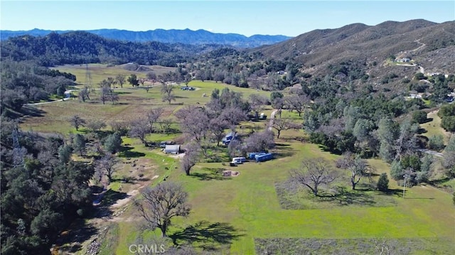 drone / aerial view featuring a mountain view and a rural view