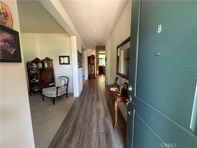 hallway featuring dark hardwood / wood-style flooring