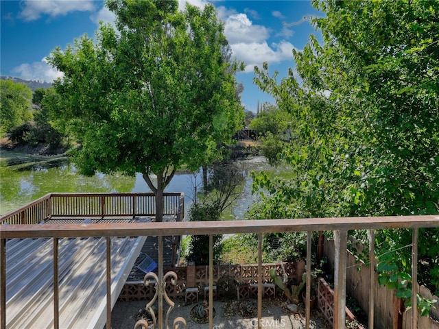 exterior space with a deck with water view