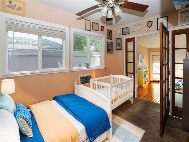 bedroom featuring hardwood / wood-style floors and ceiling fan