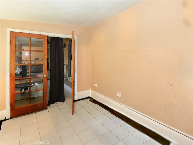 spare room featuring light tile patterned floors