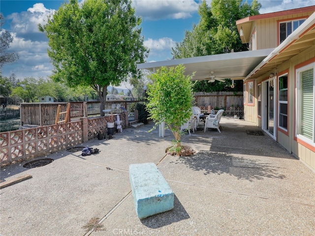 view of patio featuring ceiling fan