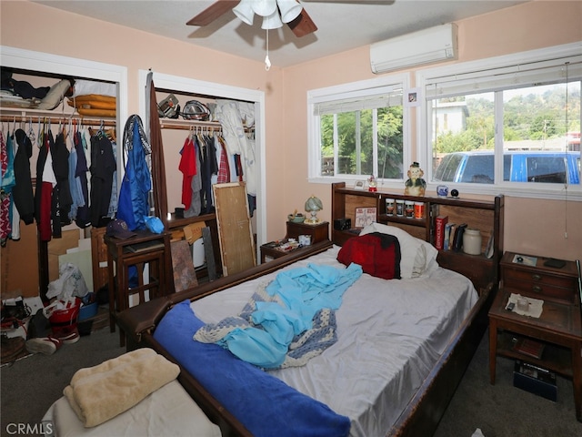 carpeted bedroom featuring ceiling fan and an AC wall unit