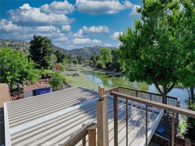 view of dock featuring a deck with water view