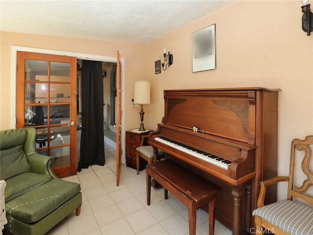 miscellaneous room featuring a textured ceiling and light tile patterned floors