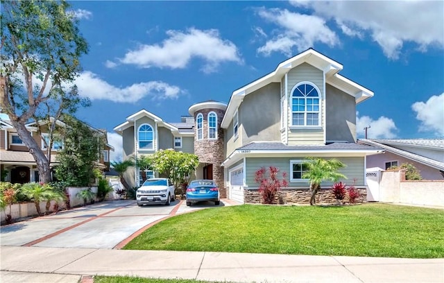 view of front facade with a garage and a front lawn