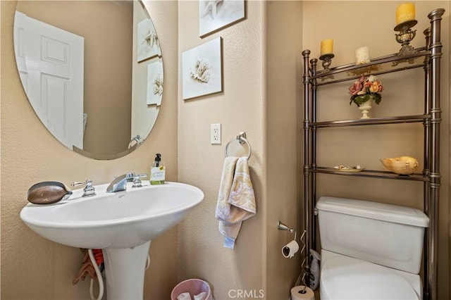 bathroom with a sink and toilet