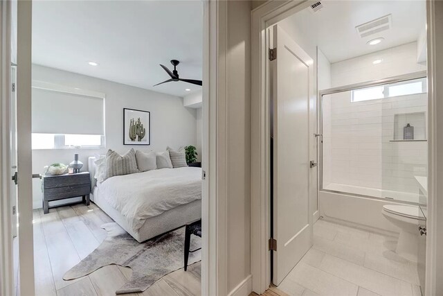 bedroom with ceiling fan and light tile patterned flooring