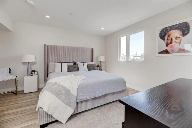 bedroom with light hardwood / wood-style floors