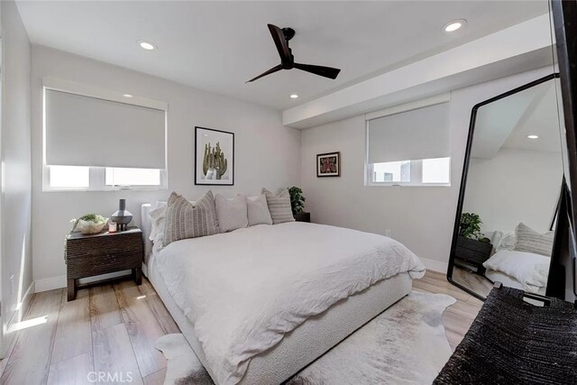 bedroom featuring ceiling fan and light hardwood / wood-style floors