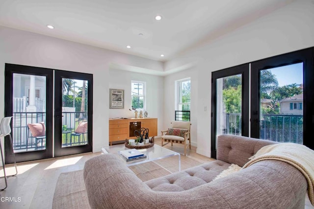 living room featuring light hardwood / wood-style flooring and french doors