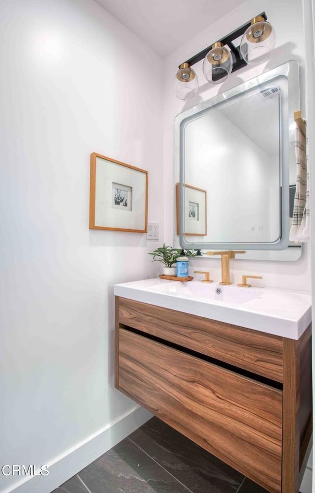 bathroom with vanity and hardwood / wood-style flooring