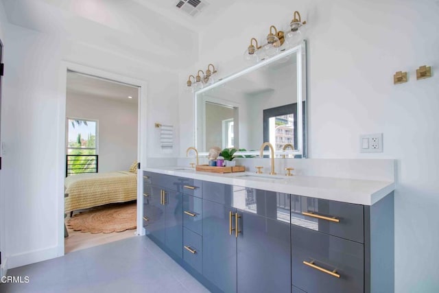 bathroom with dual vanity and hardwood / wood-style floors