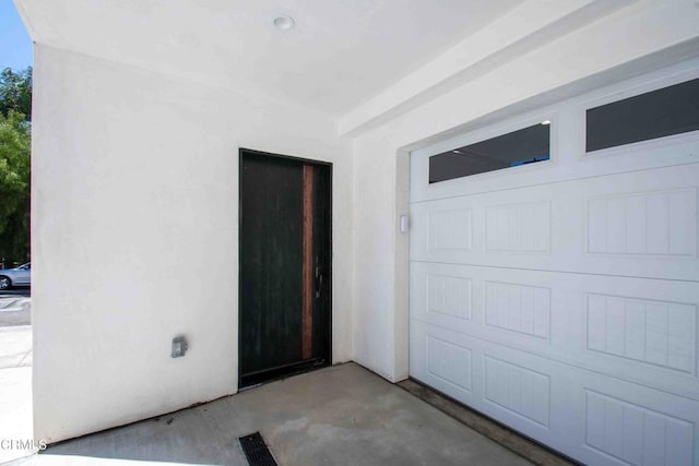 property entrance with a garage